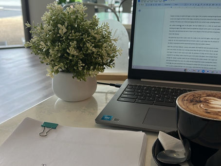 Laptop with report and coffee