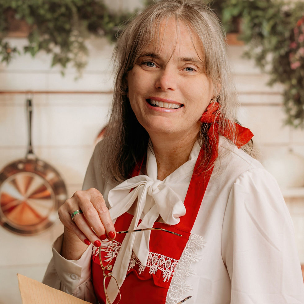 Mrs. Misty Claus in her kitchen apron sharing her love of Christmas cooking and family traditions
