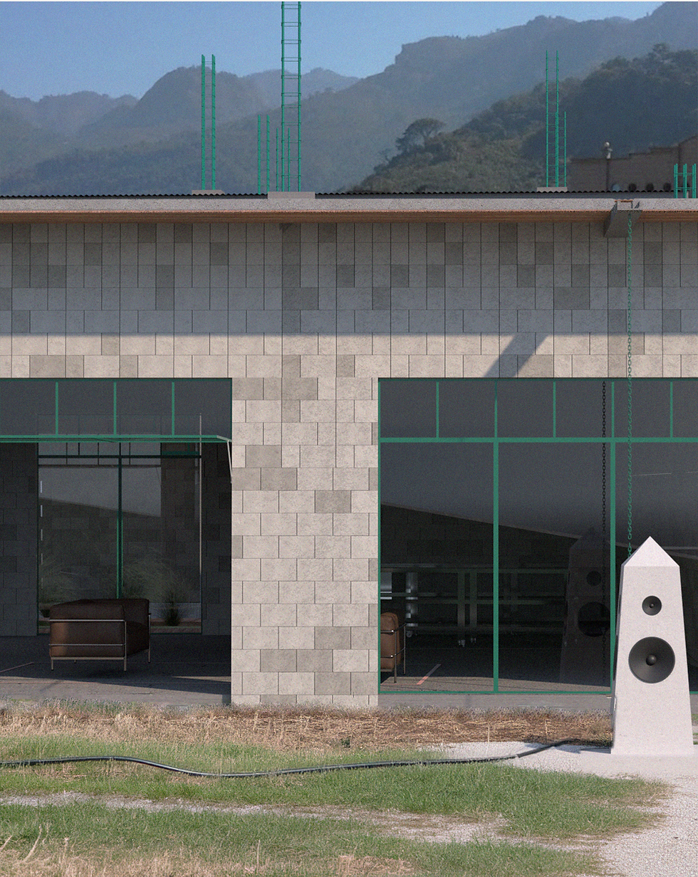 Industrial building with large glass windows, two brown chairs inside. Concrete speaker tower outside. Mountainous background, clear sky.