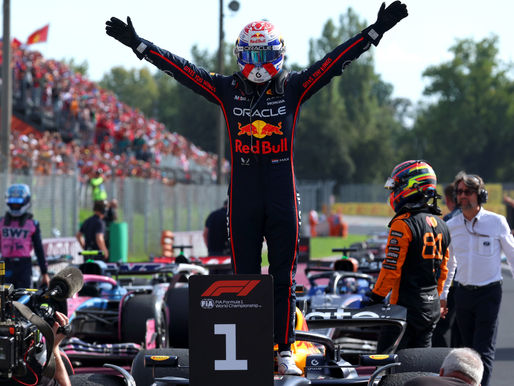 Max Verstappen standing on his car after winning the Italian Grand Prix