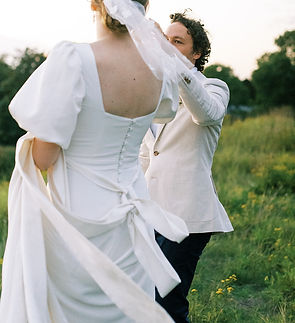 wedding couple dancing on the grass