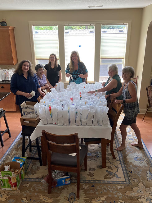 A group of volunteers assembling lunch bags to be donated to Blanchet House