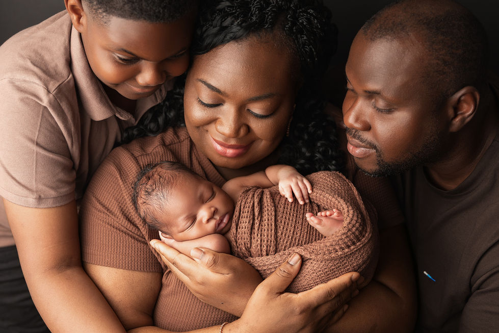 family portrait smiling at baby