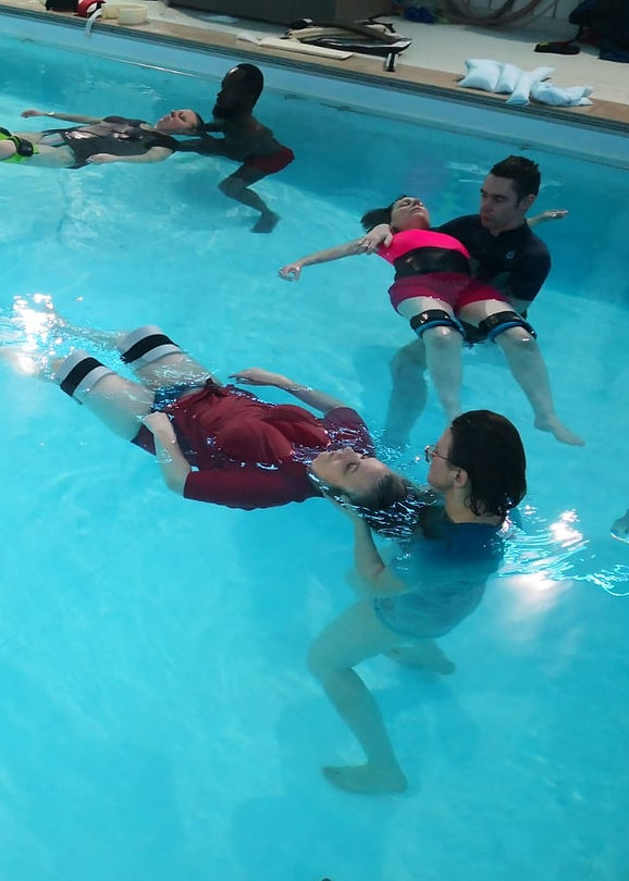 A group of swimming teachers in a Musical Hydrotherapy training session