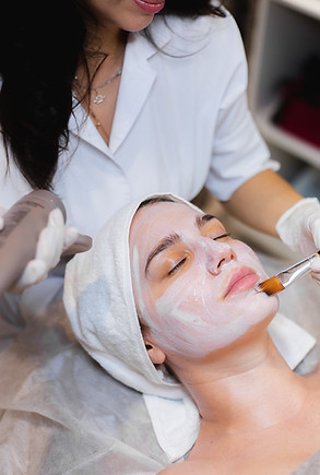 beautician-with-brush-applies-white-moisturizing-mask-face-young-girl-client-spa-beauty-sa