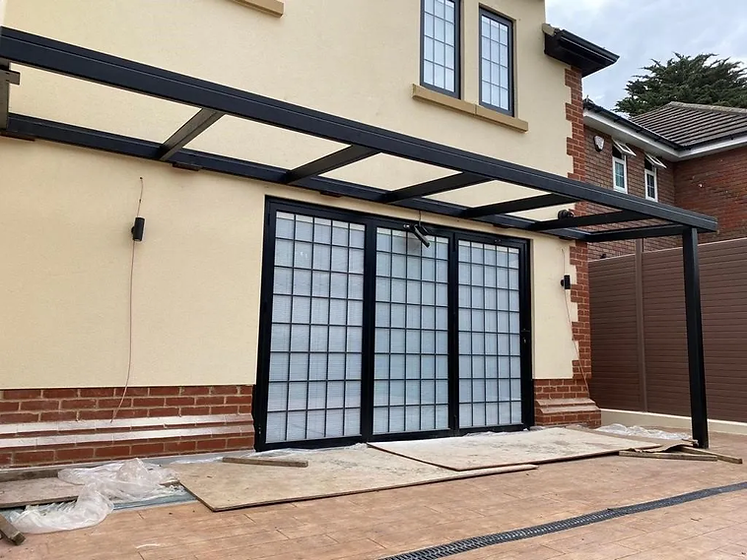 Exterior shot of a Crittall door being installed.webp