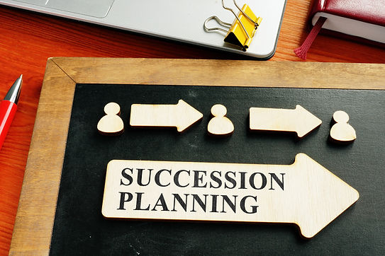 Succession planning concept. Wooden figures and arrows..jpg