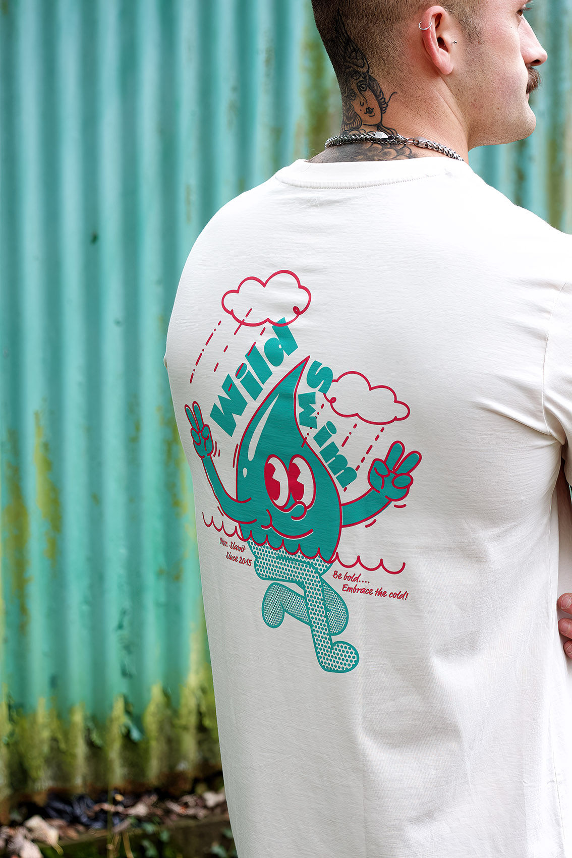 Eye-level view of a trendy urban street with people wearing various statement t-shirts