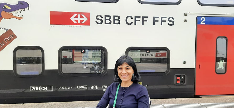 A girl in front of Swiss Railway train