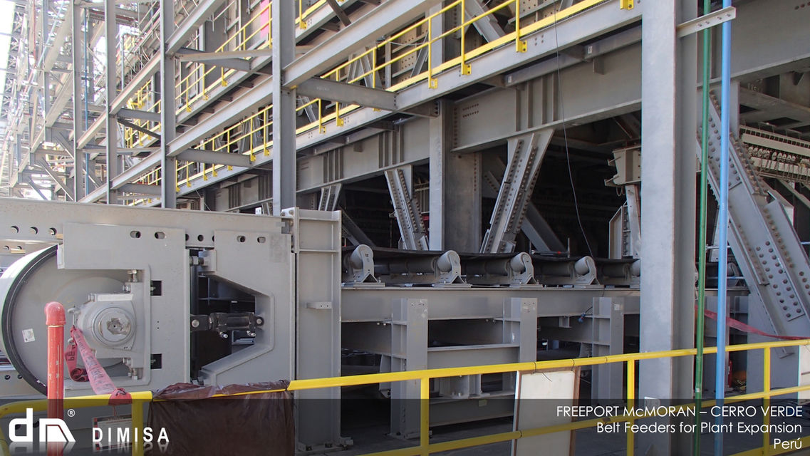 The Titans of Material Handling
At DIMISA, we set the industry benchmark with our custom-designed Heavy Duty Belt Feeders, tailored to thrive in the most demanding applications. These titans are engineered for the critical task of extracting materials from hoppers and stockpiles, specifically catering to the substantial scale of mineral processing plants at some of the world’s largest copper and iron ore mines.
Customization Meets Durability
Each feeder is a product of meticulous engineering, custom-designed to handle the rigorous demands of heavy-duty operations. We understand that in the world of material handling, one size does not fit all. That’s why our belt feeders are not pre-designed or off-the-shelf; they are bespoke solutions that are as unique as the challenges they face and the materials they transport.
Engineered for Uptime
We design with uptime in the forefront of our minds. Our belt feeders are synonymous with durability. Their robust construction ensures that they not only meet the expectations of high-capacity operations but also exceed them, offering unparalleled reliability and extended service life even in the toughest environments.
Unmatched in Performance
DIMISA’s Heavy Duty Belt Feeders are the powerhouse in material handling. They are the embodiment of strength and reliability, ensuring continuous, uninterrupted operation that is essential for the productivity of your mineral processing plant. When you choose DIMISA, you choose a partner committed to engineering excellence and the success of your operation.