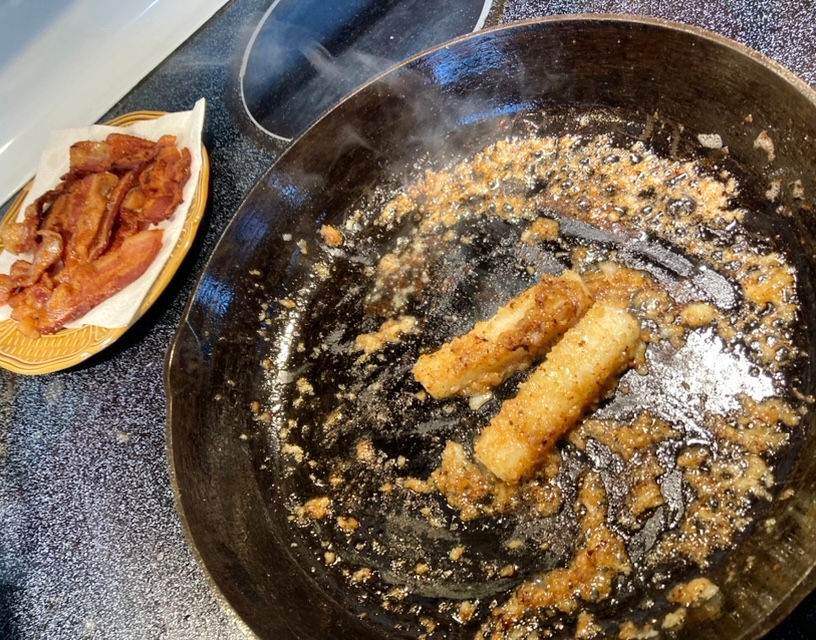 Cooking frozen onion cubes in bacon grease.