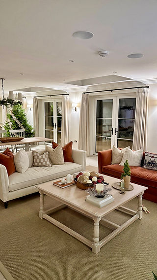 Large open plan kitchen dressed with pinch pleat curtains