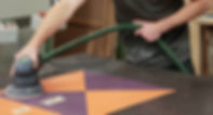 hand finishing a counter top built by Wignall's Joinery