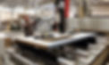A skilled worker processing Fire Doors on a machine at Wignall's Joinery Newton Abbot