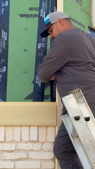White Stag Construction installing new zip system sheathing to second story of project