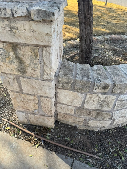 Entrance rock wall before photo