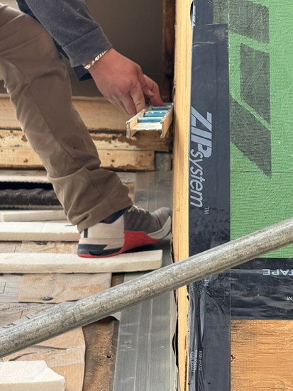 At work installing Zip System sheathing on second story home