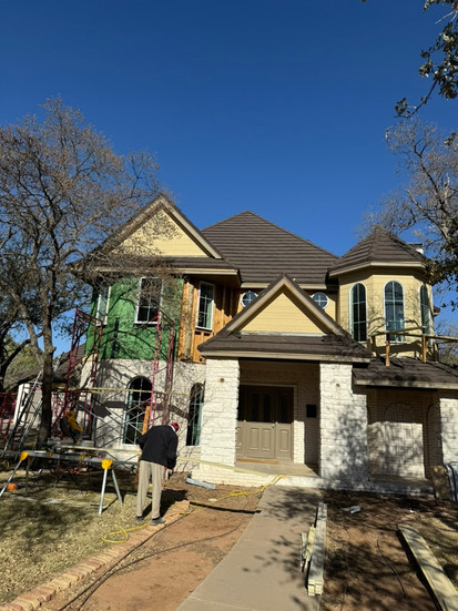 Project home exterior with White Stag's team at work on the second story