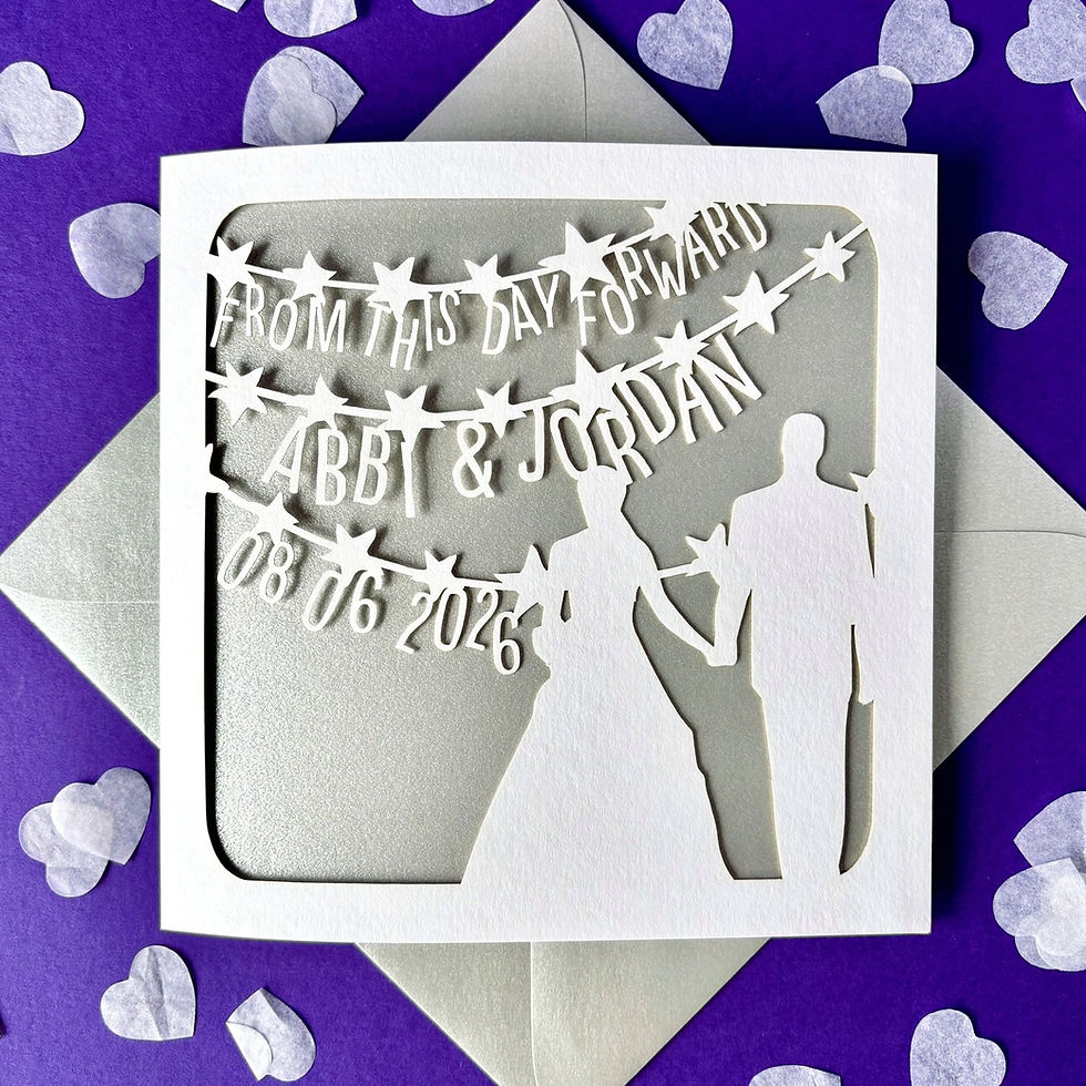 White laser cut personalised wedding card, with a bride and groom, the words 'From This Day', with a silver paper insert.