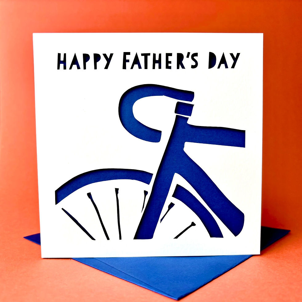 Thumbnail: White laser cut Father's Day card, with the silhouette of a road bike cut into the card, with a blue paper insert.