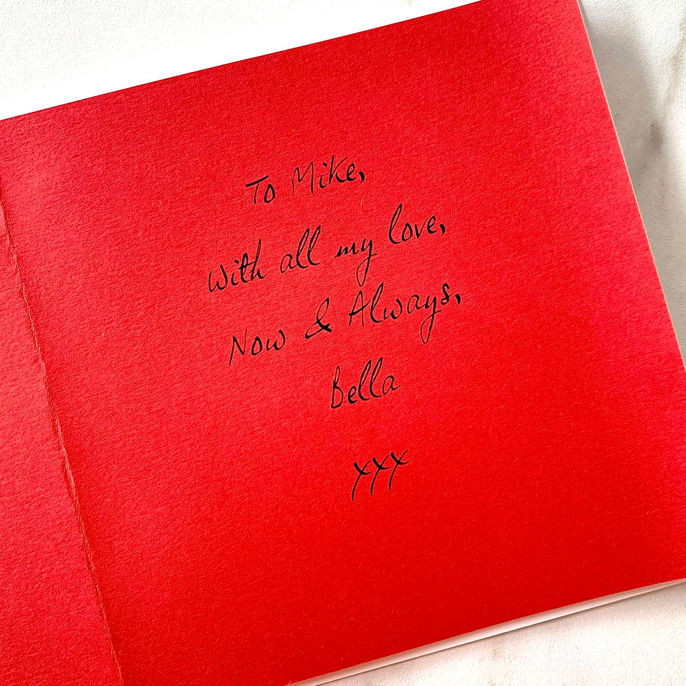 Thumbnail: Bright red paper insert inside a card, printed with a message sending love to the recipient in a handwritten-style font.