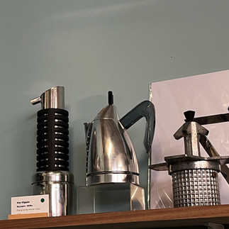 Exhibition of different designs of moka pots across the 20th century