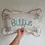 Thumbnail: Personalized Embroidered Name Cushion: Floral Ruffle Nursery Decor