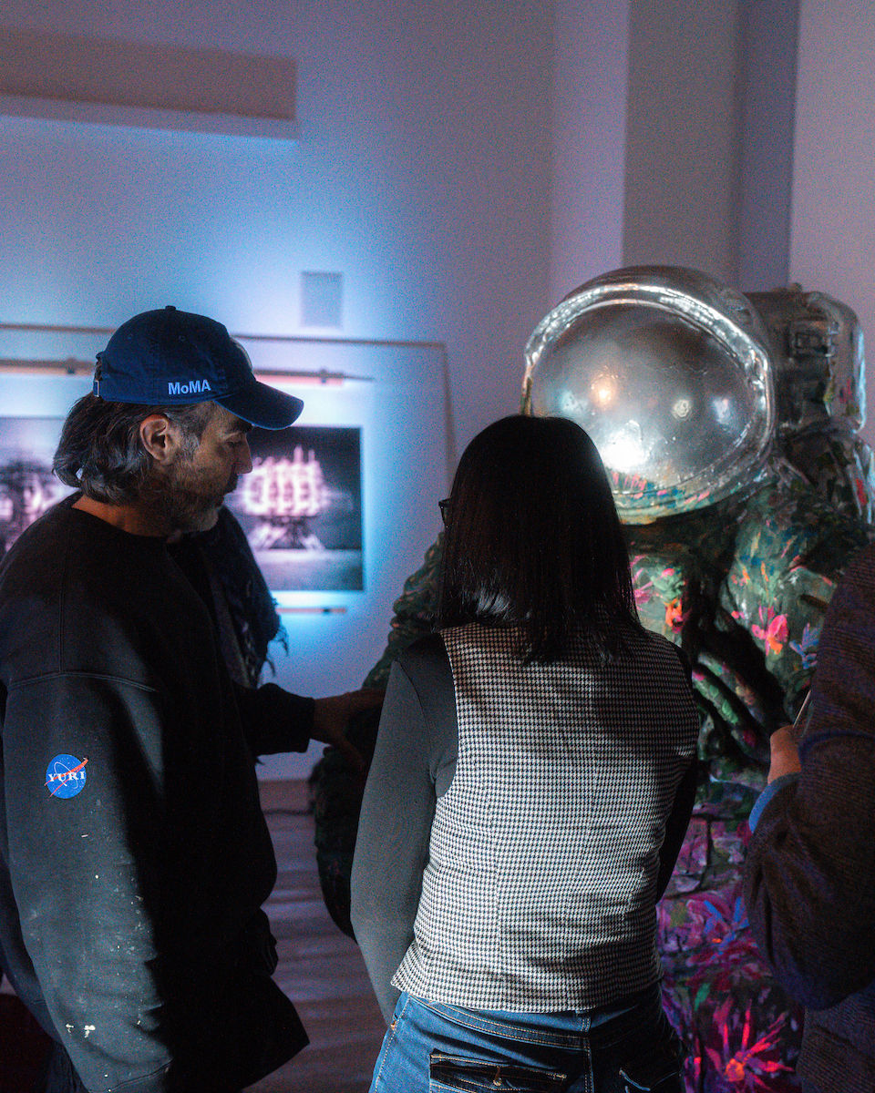 Yuri Catania meeting AI enthusiastic at Lugano AI Week 2025 discussing AI art.