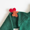 Thumbnail: Winter Cherry | Green Christmas sweater for Baby- Arm view