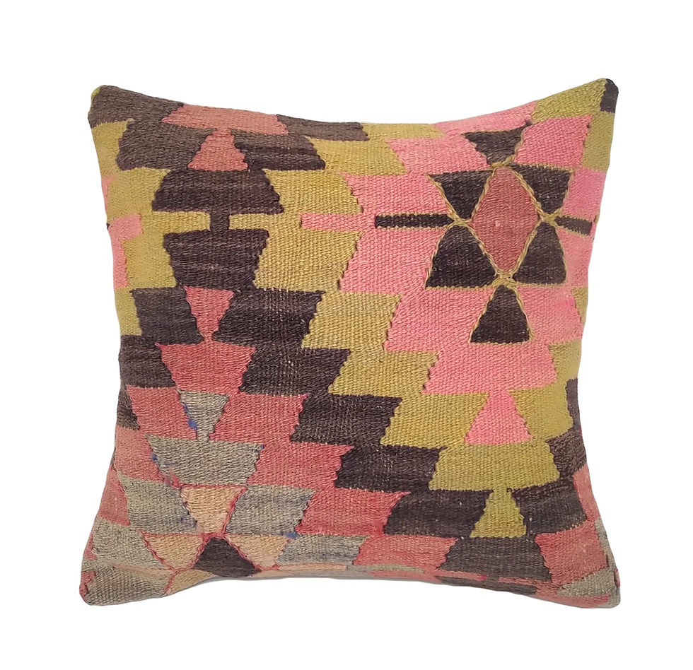 An 18x18 Kilim throw pillow cover with Aztec inspired boho design in pink, yellow, brown, and blue wool