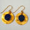 Thumbnail: Golden disc earrings with a Lapis gemstone