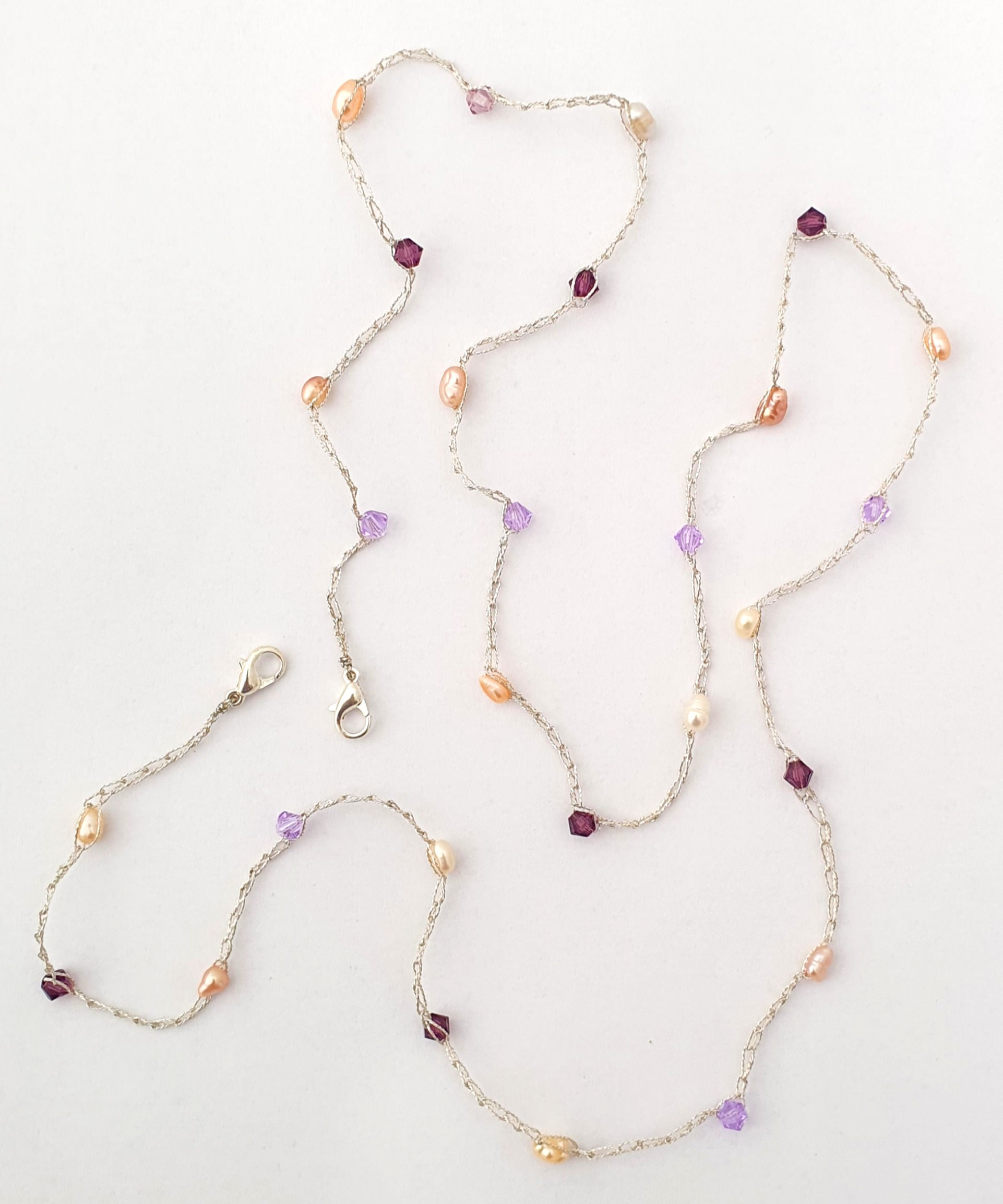 Handmade silk thread necklace with purple and pink crystals