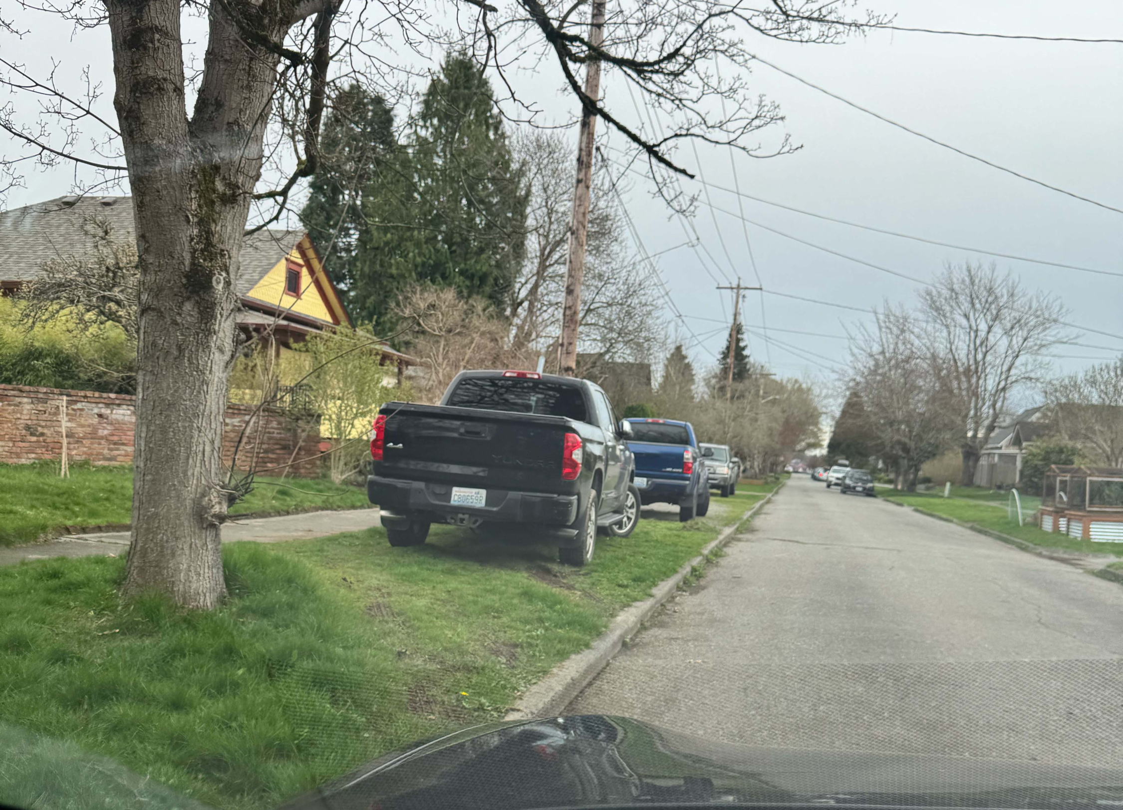 Vehicles parked on lawns due to older streets and no safe on street parking