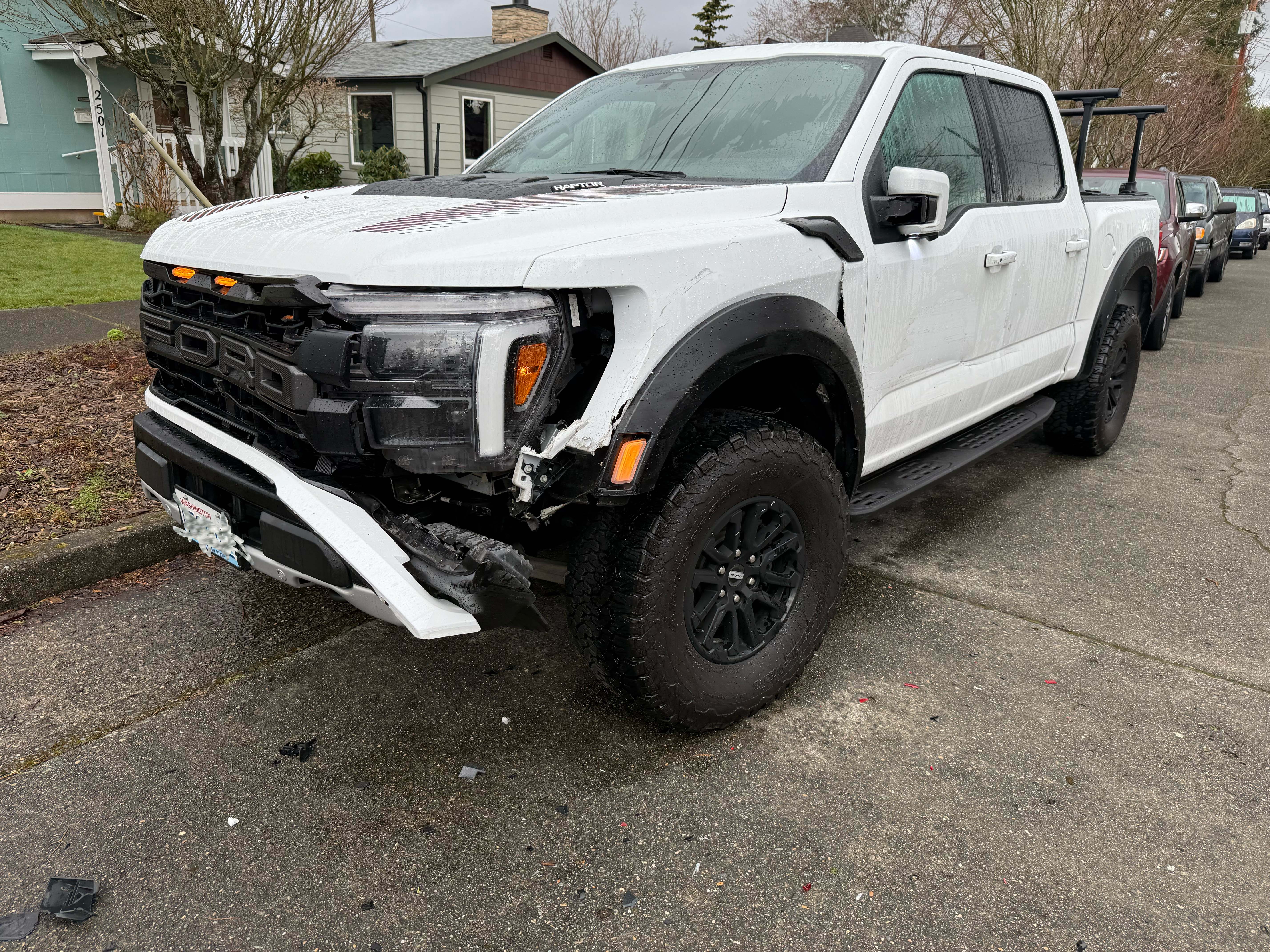 Damaged truck from being parked on street and the older street is not wide enough for parking on both sides.