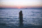 Woman walking through waves_edited_edited.jpg