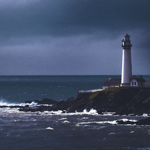 A lighthouse perched on a rocky coast