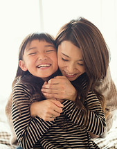 Mother and Daughter Hugging