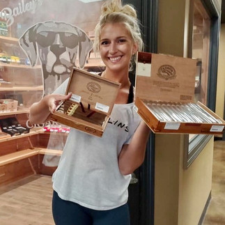 Hannah displays premium cigars