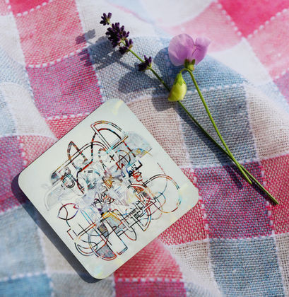 Scottish art - Coaster with a colourful design inspired by Celtic art on tartan fabric with a flower