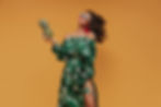 curly-haired-modern-girl-with-red-bright-big-lips-and-unusual-earrings-in-stylish-green-an