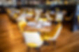 Dining room with yellow chairs and tables, Liberty & Main restaurant.