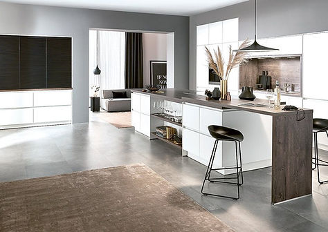 white gloss kitchen open plan living, integrated appliances from bosch, laminate wood effect breakfast bar with downturn waterfall edge detail.