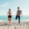 couple-stretching-beach.jpg