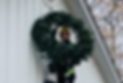 Blair the Christmas light installer with a deluxe four foot wreath