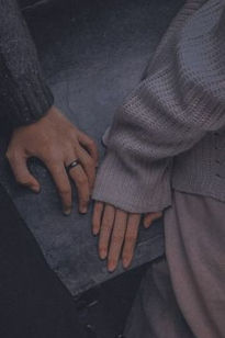 Fingertips close but not touching, symbolizing the anticipation of making the first move.