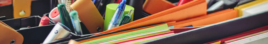 Close-up of pens and papers