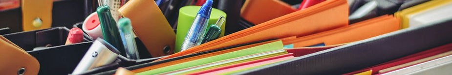 Close-up of pens and papers