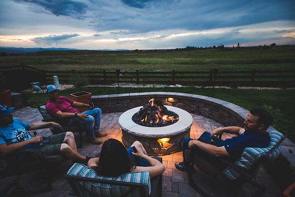People+enjoying+a+gas+fire-pit+and+paver