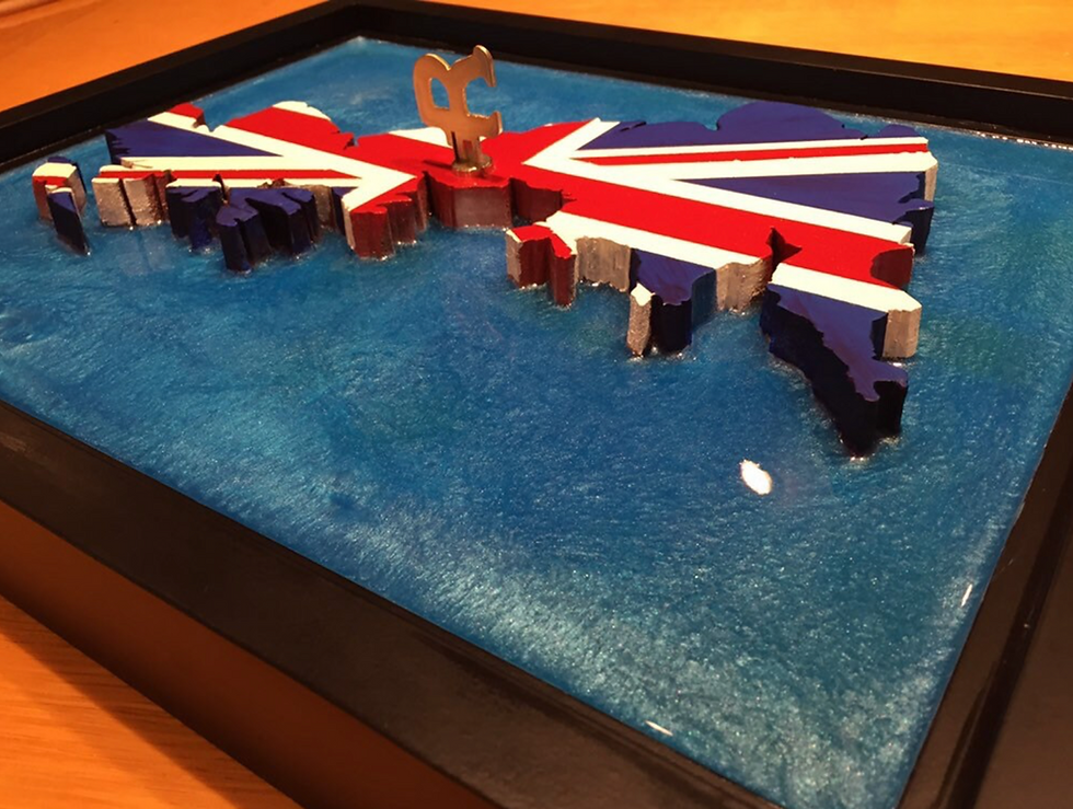 Thumbnail: Anarchy in the UK. 11” x 14” wood cut out map of the United Kingdom with Epoxy  resin surrounding ocean.  Framed