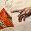 Thumbnail: The Almighty Cheetos Finger. A cheesy twist on Michelangelo's Hand of God